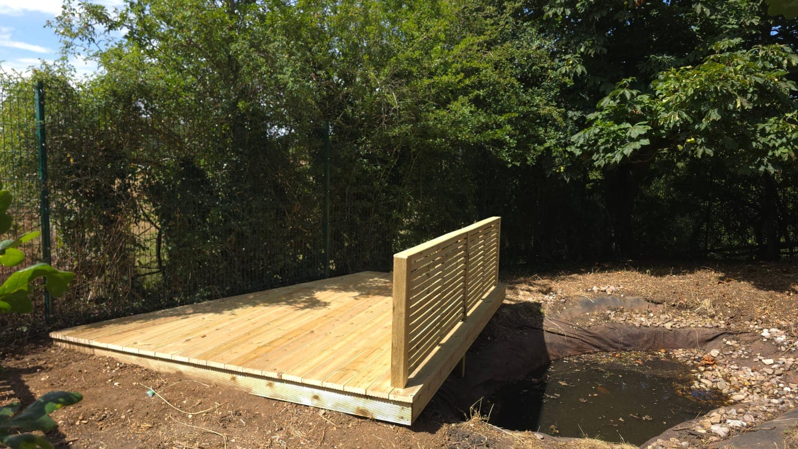 New viewing deck over the pond with a slatted timber screen