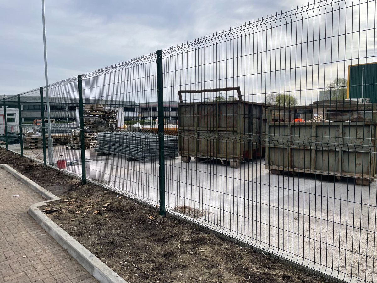 Mesh security fencing around a commercial yard