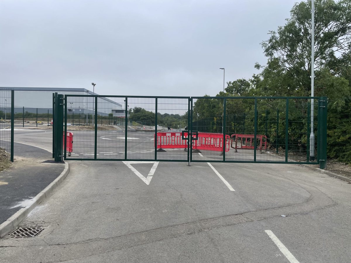 Secured access gates across a site entrance